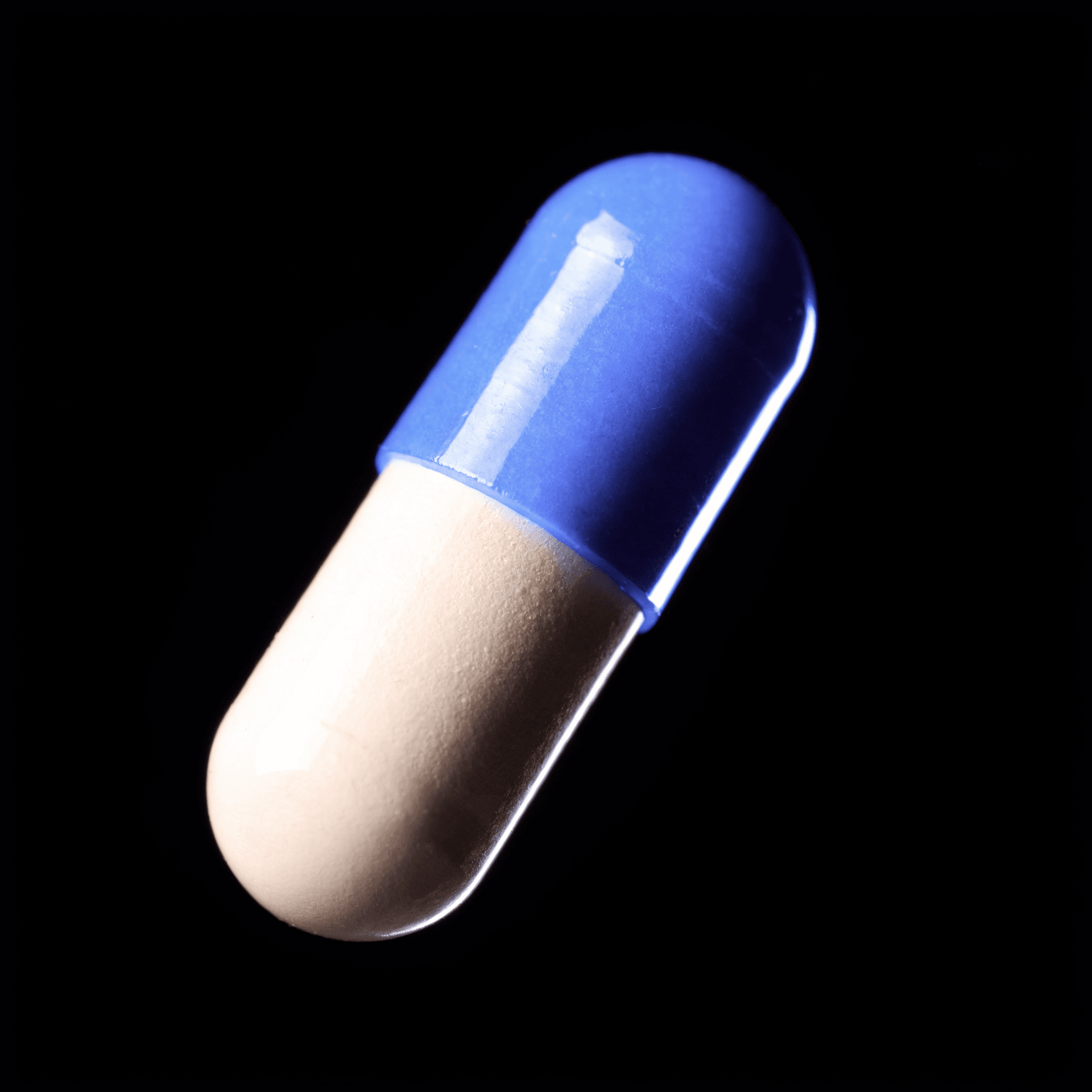 A two-piece capsule, shown as a generic format illustration